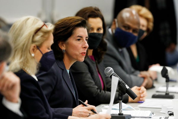 Gina Raimondo sits at a table while discussing the impact of the semiconductor chip shortage.
