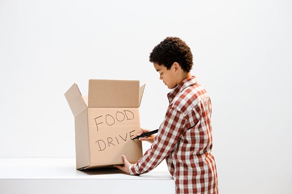 boy with food drive box