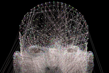 A human head made up of glowing dots connected by glowing lines.