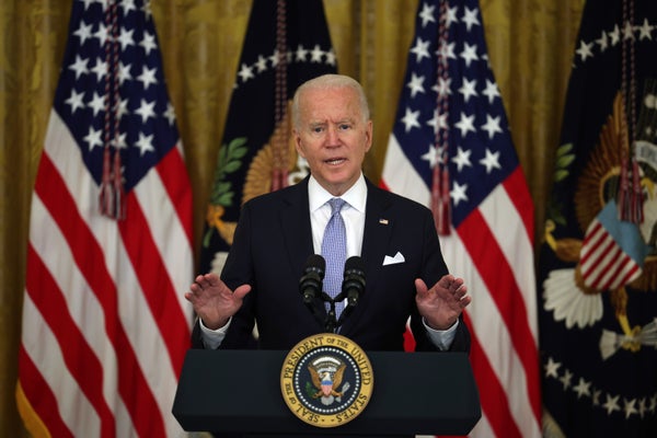 President Joe Biden gestures as he delivers remarks in the East Room of the White House on July 29.