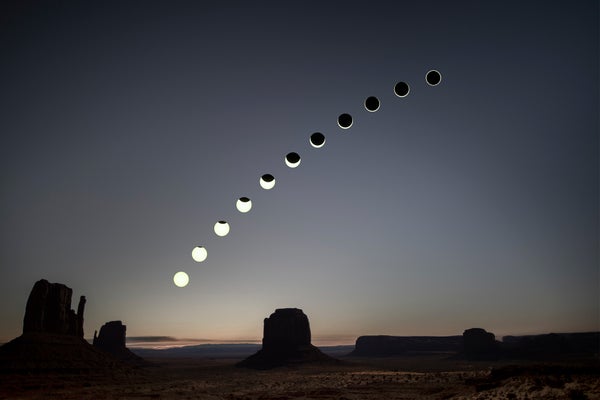 Composited photographs of different stages of a solar eclipse in Monument Valley Navajo Tribal Park on October 14, 2023
