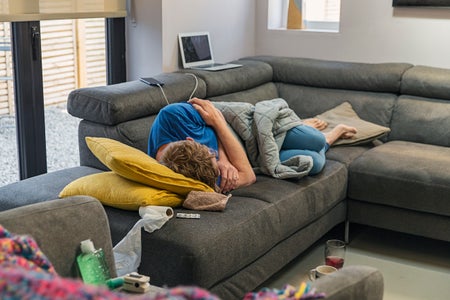 Man struggling with flu like symptoms