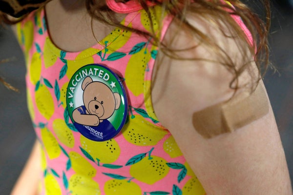 Close up of pin on child's shirt.