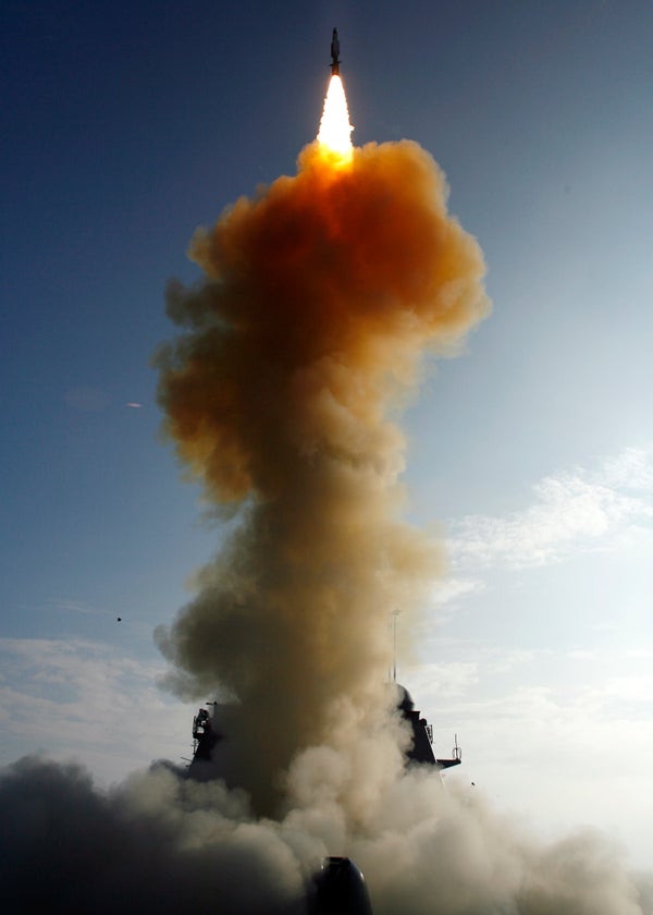 A missile launches from a ship to target a satellite in low-Earth orbit.