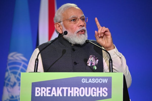 India's Prime Minister Narendra Modi speaking at lectern.